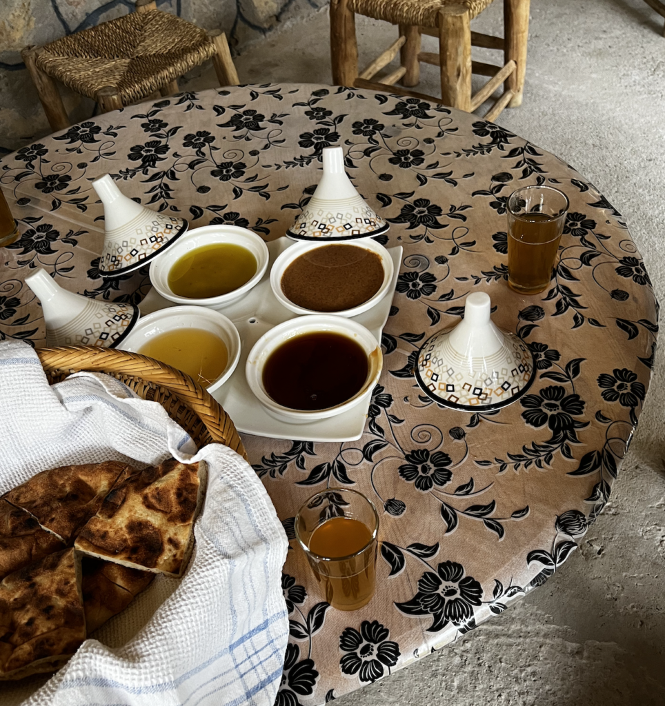 a circular table with small bowls and different types of honey made in Agadir, Morocco