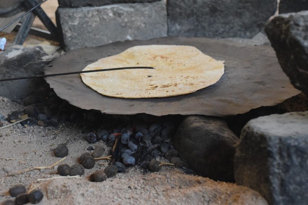 Camel dung cooking bread in a Bedouin Village