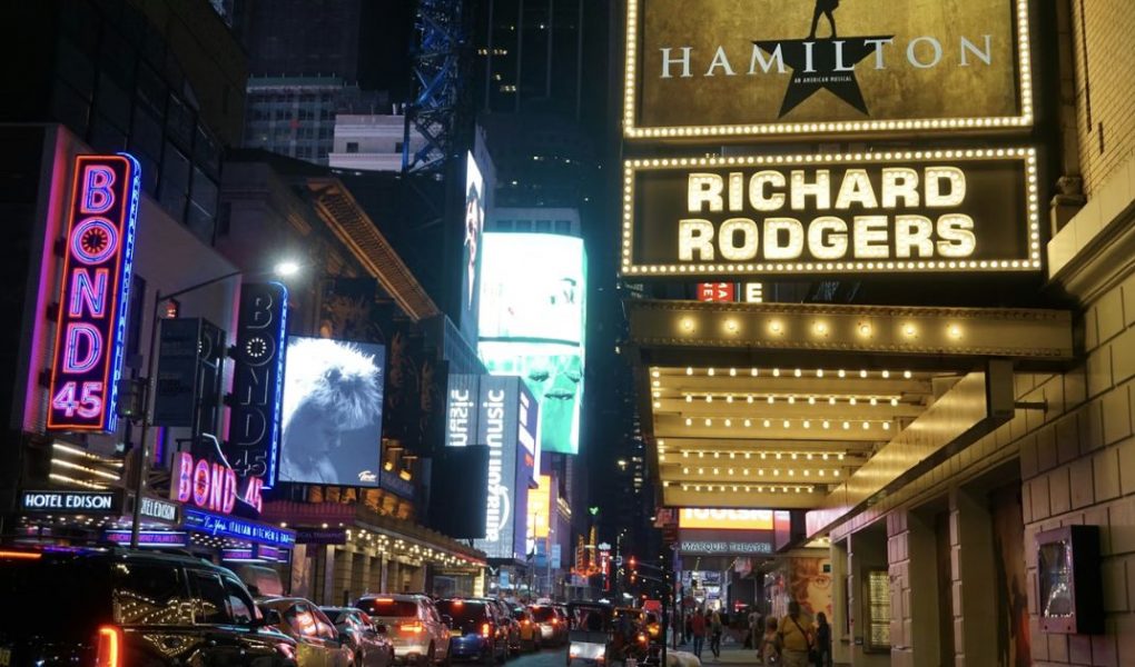 Broadway theatres lit up at night in New York City
