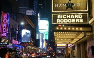 Broadway theatres lit up at night in New York City