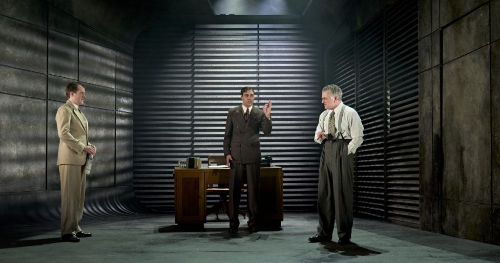 Ciaran Owens (Walter Huff), Joseph Langdon (Mr Norton) and Martin Marquez (Keyes) - Credit - Manuel Harlan